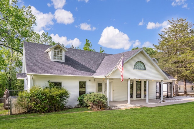 view of front facade featuring french doors and a front yard