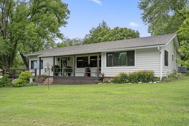 single story home with a front lawn and cooling unit