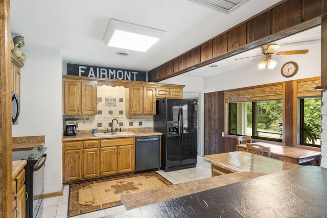 kitchen with ceiling fan, light tile patterned flooring, sink, tasteful backsplash, and black appliances