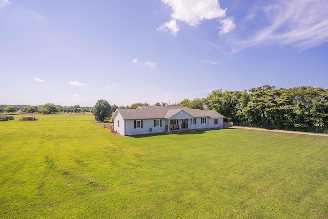 view of front of house featuring a rural view and a front yard