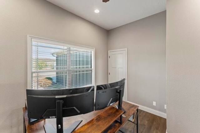 dining space with dark hardwood / wood-style floors and ceiling fan