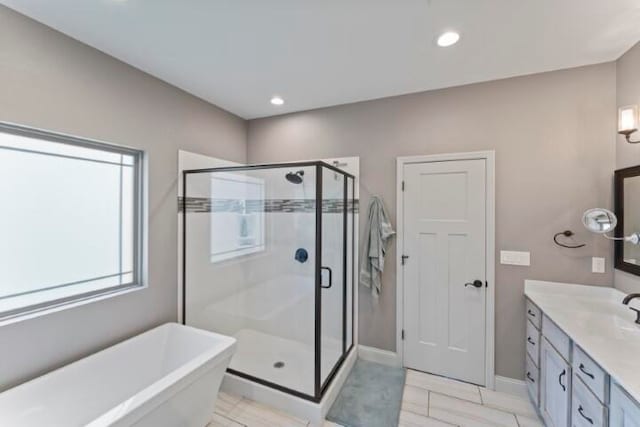 bathroom with vanity, plus walk in shower, and hardwood / wood-style floors