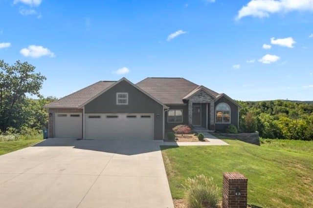 view of front facade featuring a front yard and a garage