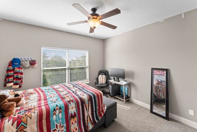 carpeted bedroom featuring ceiling fan