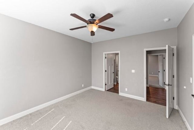 unfurnished bedroom featuring ceiling fan and carpet flooring