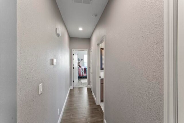 hallway featuring dark hardwood / wood-style floors