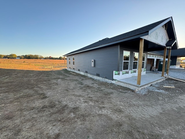 view of property exterior with a patio