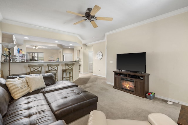 living room featuring ceiling fan, light colored carpet, and ornamental molding