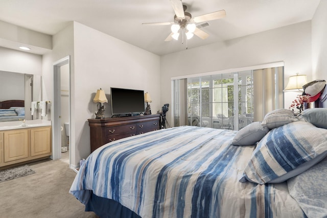 bedroom featuring ensuite bathroom, access to exterior, ceiling fan, and light carpet