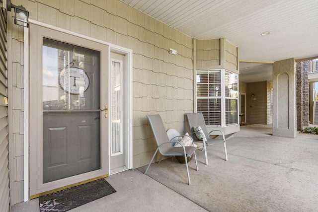 doorway to property featuring a patio area