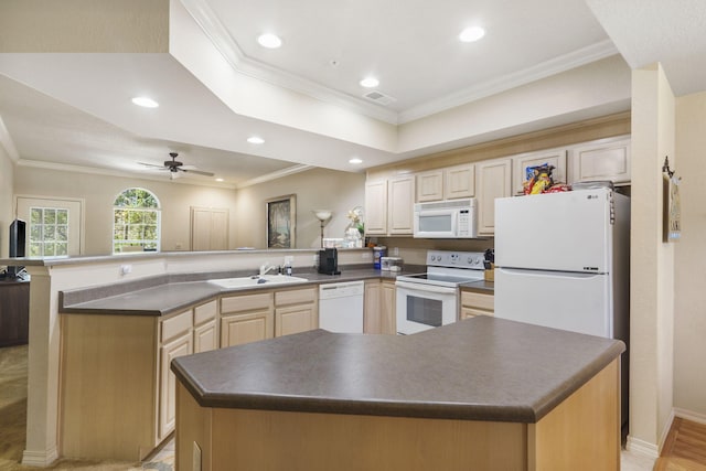 kitchen with light hardwood / wood-style floors, white appliances, crown molding, a kitchen island, and kitchen peninsula