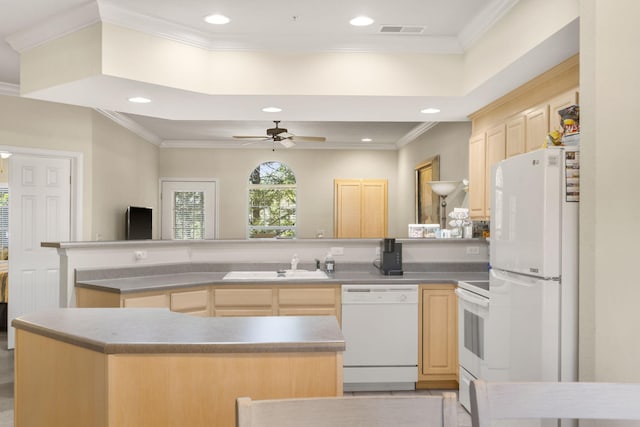 kitchen with white appliances, sink, kitchen peninsula, crown molding, and light brown cabinetry