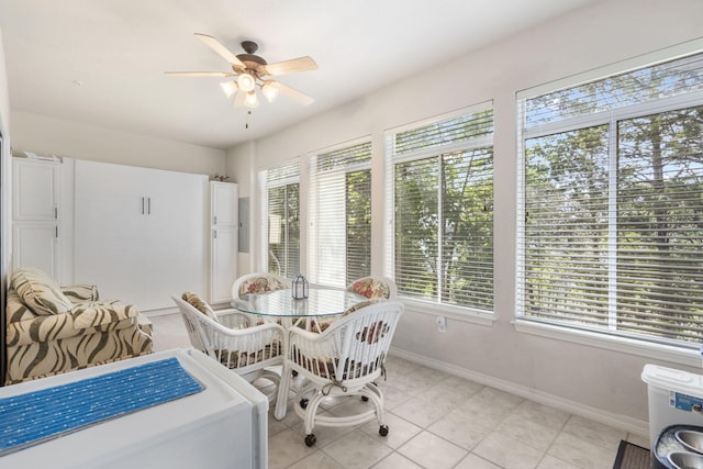 dining area featuring ceiling fan, plenty of natural light, and light tile patterned floors