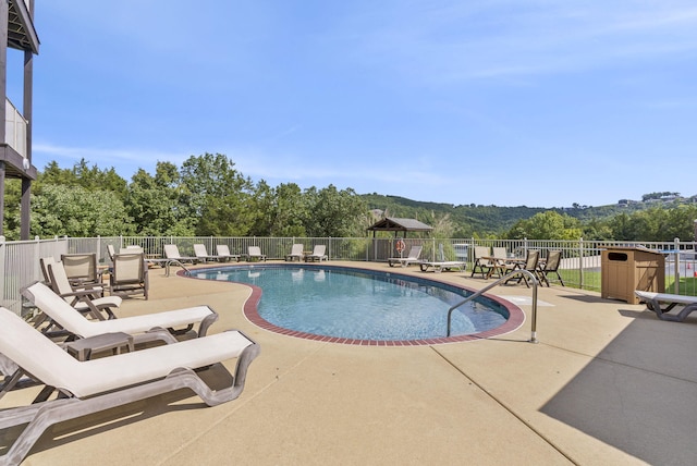 view of swimming pool with a gazebo and a patio