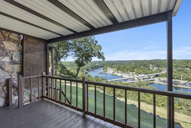 wooden deck with a water view