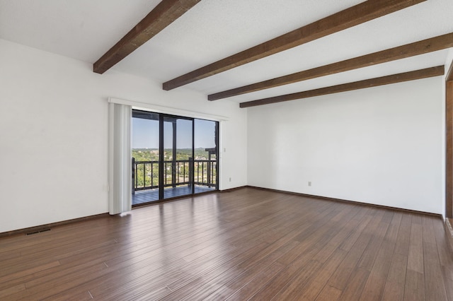 spare room featuring beamed ceiling, baseboards, visible vents, and dark wood-type flooring