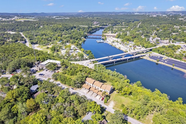bird's eye view with a forest view and a water view