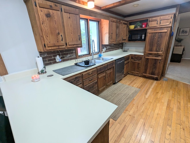 kitchen with dishwasher, light hardwood / wood-style floors, kitchen peninsula, and backsplash