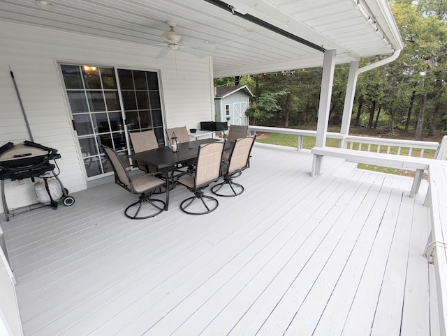 wooden terrace featuring ceiling fan