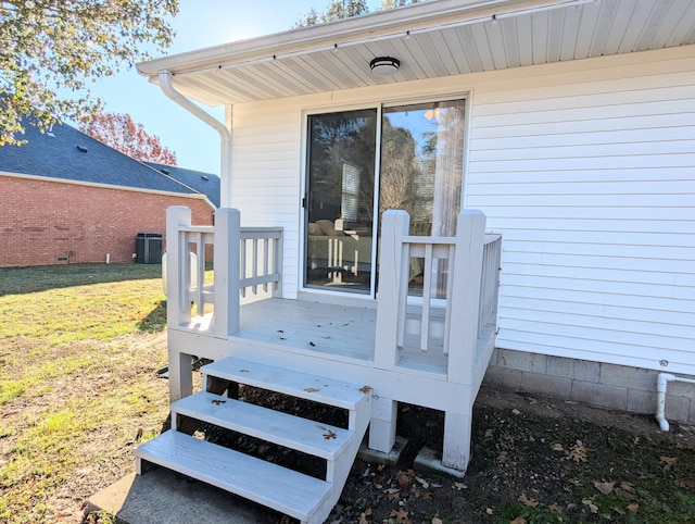 wooden terrace with central AC unit and a lawn