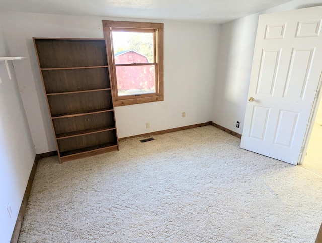 unfurnished bedroom with carpet floors