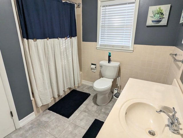 full bathroom with tile patterned flooring, shower / bath combination with curtain, tile walls, and toilet