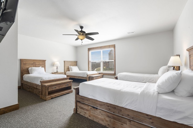 bedroom with dark carpet and ceiling fan