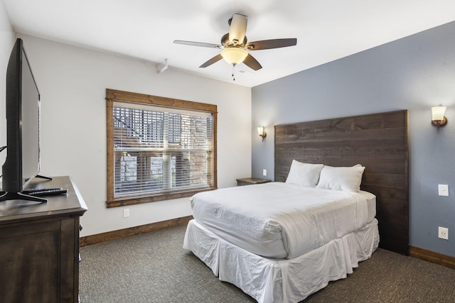 bedroom featuring dark colored carpet and ceiling fan