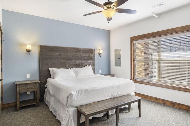 carpeted bedroom featuring ceiling fan and electric panel