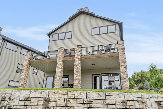 rear view of house with a balcony