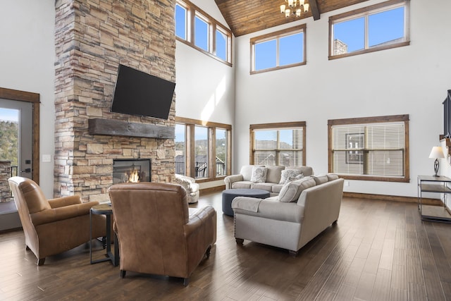 living room with plenty of natural light, dark wood-type flooring, and high vaulted ceiling