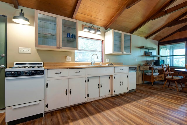 kitchen with white cabinets, white range, lofted ceiling with beams, and a wealth of natural light