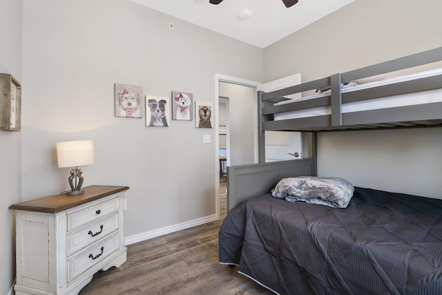 bedroom featuring ceiling fan and dark wood-type flooring