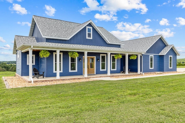 view of front of house featuring covered porch and a front lawn