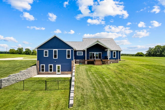 back of house featuring a yard