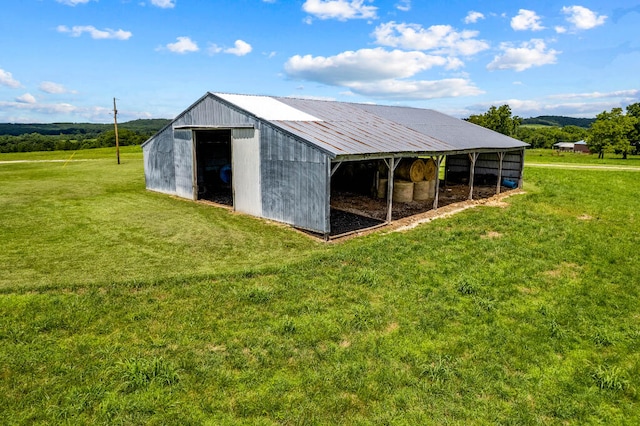 view of stable featuring a rural view