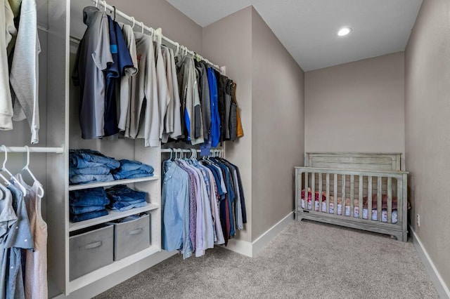 spacious closet with carpet floors