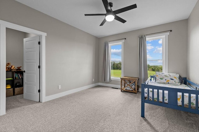 bedroom featuring visible vents, baseboards, carpet, and ceiling fan