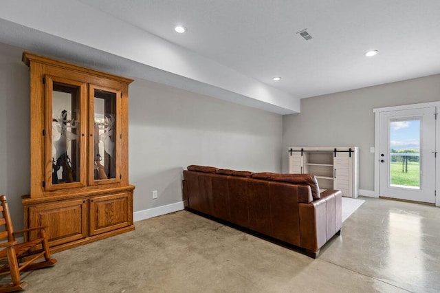 living room featuring recessed lighting, visible vents, baseboards, and concrete floors