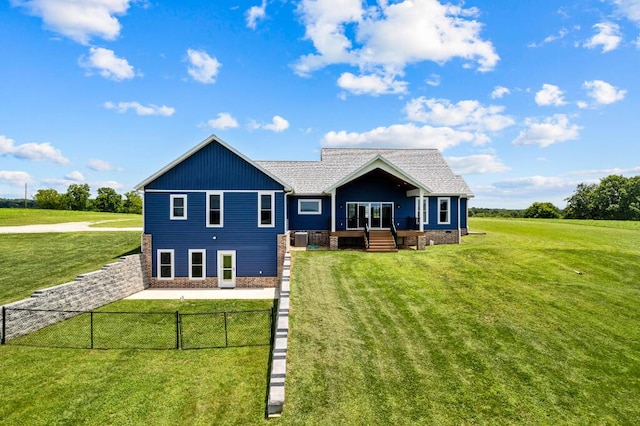 back of house featuring a yard, fence private yard, and a wooden deck