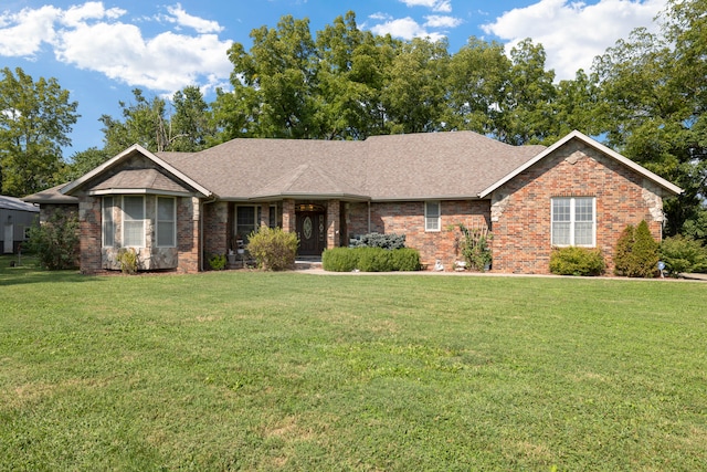 ranch-style home with a front lawn