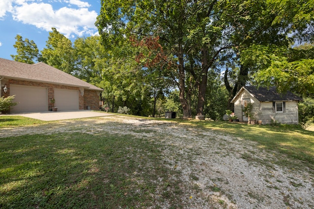 view of yard featuring a garage