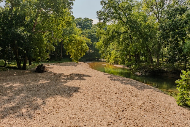 view of home's community with a water view