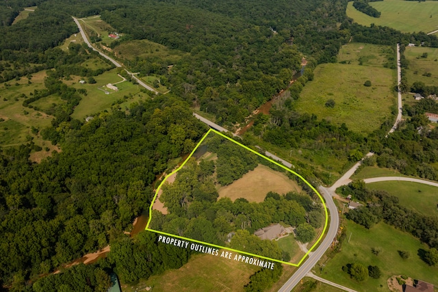 birds eye view of property with a rural view