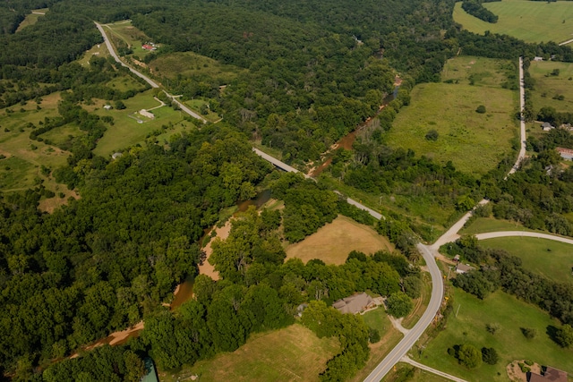 birds eye view of property with a rural view