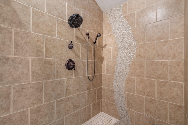 bathroom with tiled shower