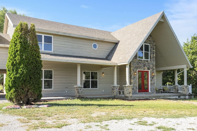 view of front of property featuring a porch and a front lawn