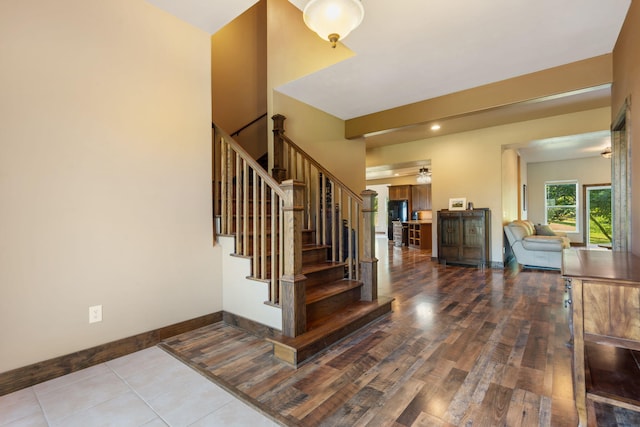 staircase with hardwood / wood-style flooring