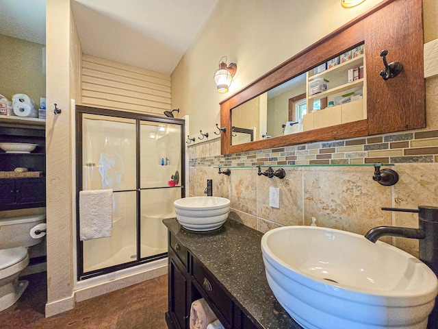 bathroom featuring an enclosed shower, tile walls, vanity, and toilet