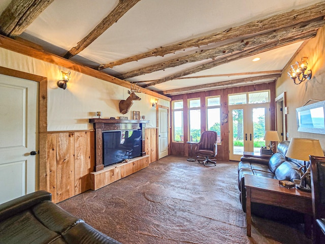 living room featuring french doors and vaulted ceiling with beams